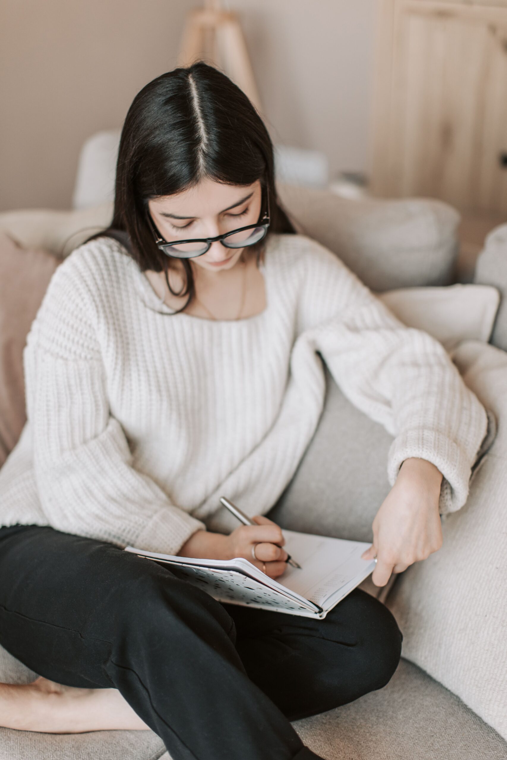 Woman working on money reset planner